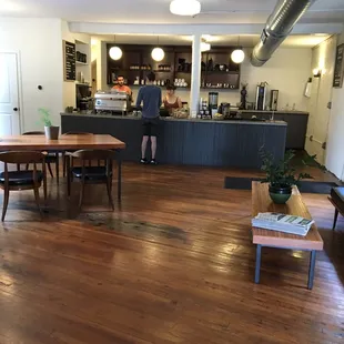 a man standing in a coffee shop