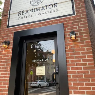 the front door of a brick building