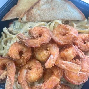 a plate of shrimp and pasta
