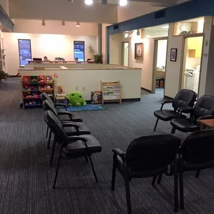 Waiting room on upper floor of RKL. Reception desk as you walk in, comfortable seating and kids activity center.
