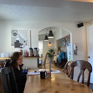 a little girl sitting at a table