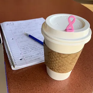 a cup of coffee and notebook