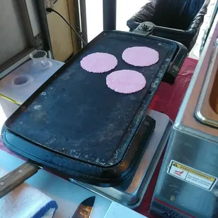 a pan of pancakes being prepared