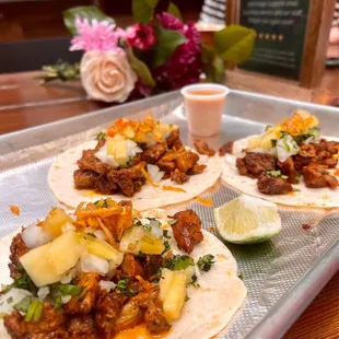 Tacos Al Pastor ($18) red sauce, lime