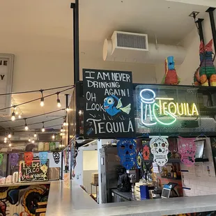a neon sign in a mexican restaurant
