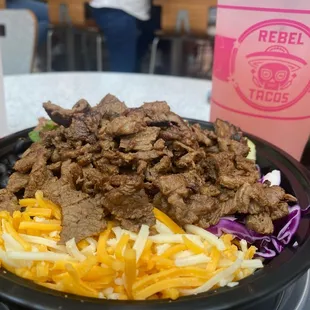 Rebel bowl with Carne Asada and a watermelon lemonade