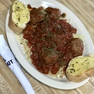 Spaghetti in homemade sauce and gigantic meatballs