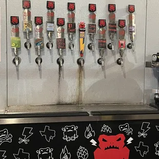 a row of beer taps