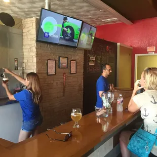 Shot of bar. That&apos;s the owners behind bar. Super cool!