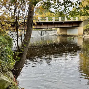 a river flowing under a bridge