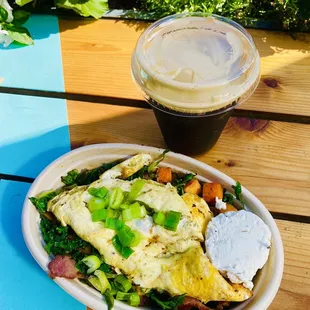 Kale salad with scramble egg on top, with cold brew