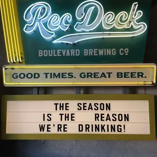 a neon sign that reads, the season is the reason we're drinking