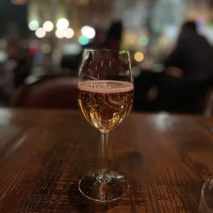 a glass of wine on a table