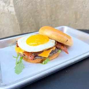 a breakfast sandwich on a tray