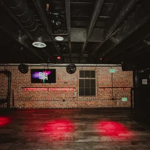 a brick wall with red lights