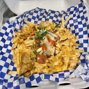 Fries with crawfish, shrimp and chicken and sauce. Nom nom