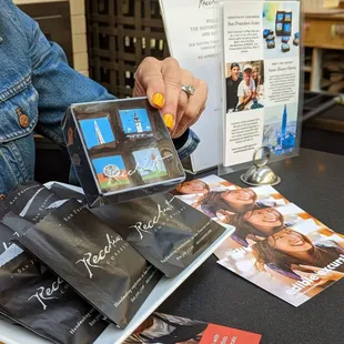 a woman holding a stack of books