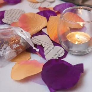 We provided the petals, paper hearts (from Harry Potter!), and the favors. Receptions staff set it all up for us.