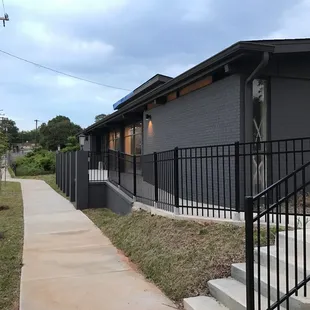 Sidewalk view leading to front patio
