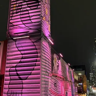 a building with a pink light on it