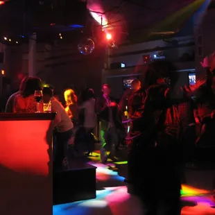 a group of people dancing at a nightclub