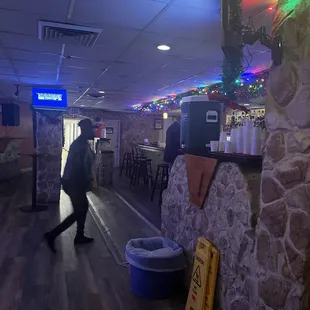 a man walking through a restaurant