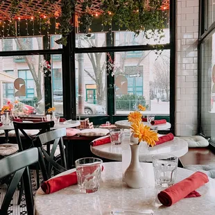 a dining room with tables and chairs