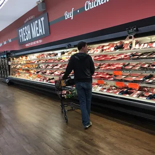 a man shopping in a grocery store