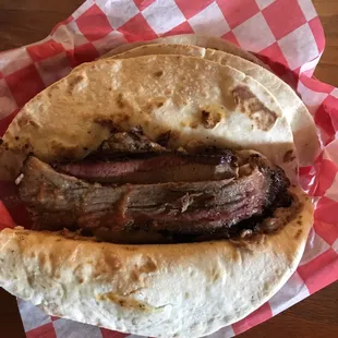 a steak sandwich in a pita