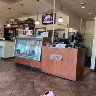 a kitchen with a counter and a television
