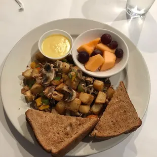 Salmon hash with mushrooms and a side hollandaise