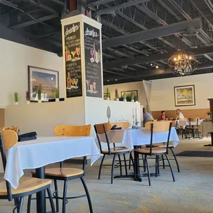 a restaurant with tables and chairs