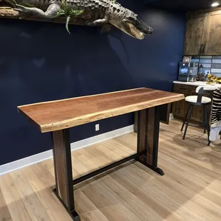 Bar Table - live edge walnut top with walnut inlays for steel base ends.