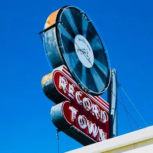 The iconic Record Town sign on a bright sunny day.
