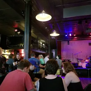 a group of people sitting at a bar