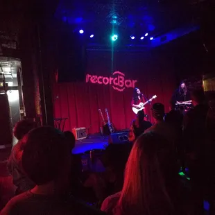 a group of people in a dark room