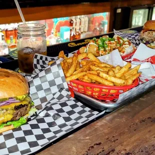 a burger and fries on a table