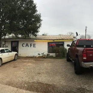 two cars parked in front of the building