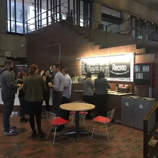 a group of people in a coffee shop