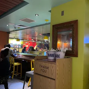 a restaurant counter with a sign that says babe babe thank you