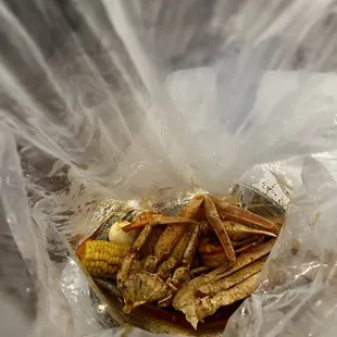 a sandwich wrapped in plastic wrap