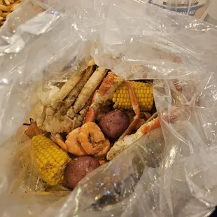 Snow crab, shrimp, potatoes, eggs &amp; sweet corn in an old bay, lemon pepper, garlic butter sauce