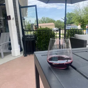 a glass of wine on a table