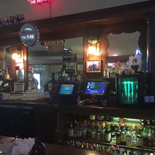 Wooden bar back. Sets a casual old school tavern