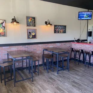 New hightop seating and bar seating with our TV sets showing sports
