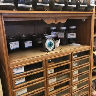 a shelf of jars and a clock