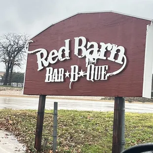 ows a sign for a bar