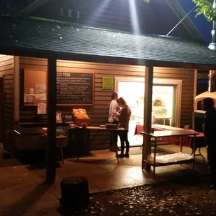 Pizza oven barn at night