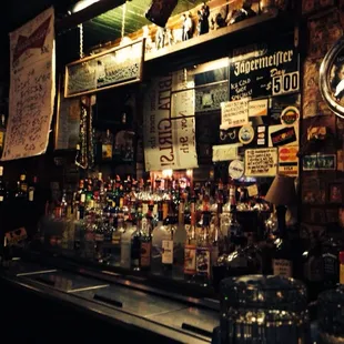 a bar filled with bottles of alcohol