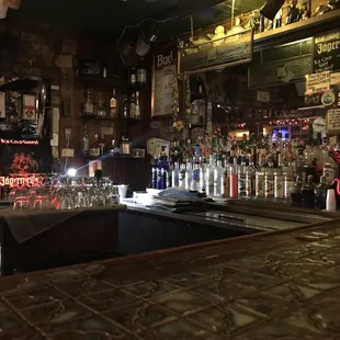a bar with bottles of alcohol